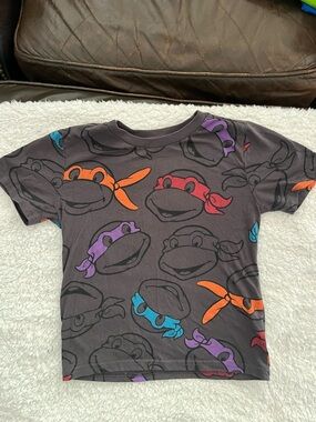 Nickelodeon Black Tee with Red, Orange, Purple & Blue Ninja Faces